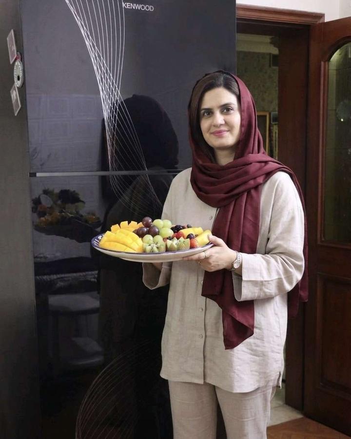 Zaineb Danish holding a platter of fresh fruit